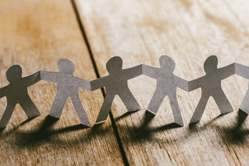 Paper People Holding Hands