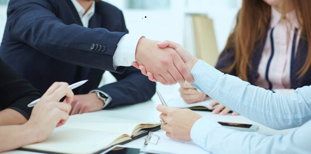 Male and Female Handshake in Office