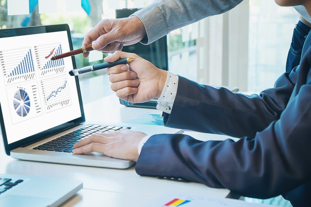 Business People Using Computer to Analyze Marketing Data